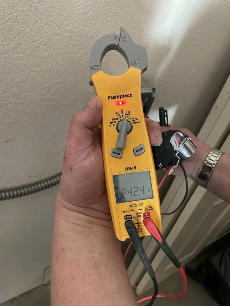Voltage testing with clamp meter during Circuit Breaker Repair in Krum